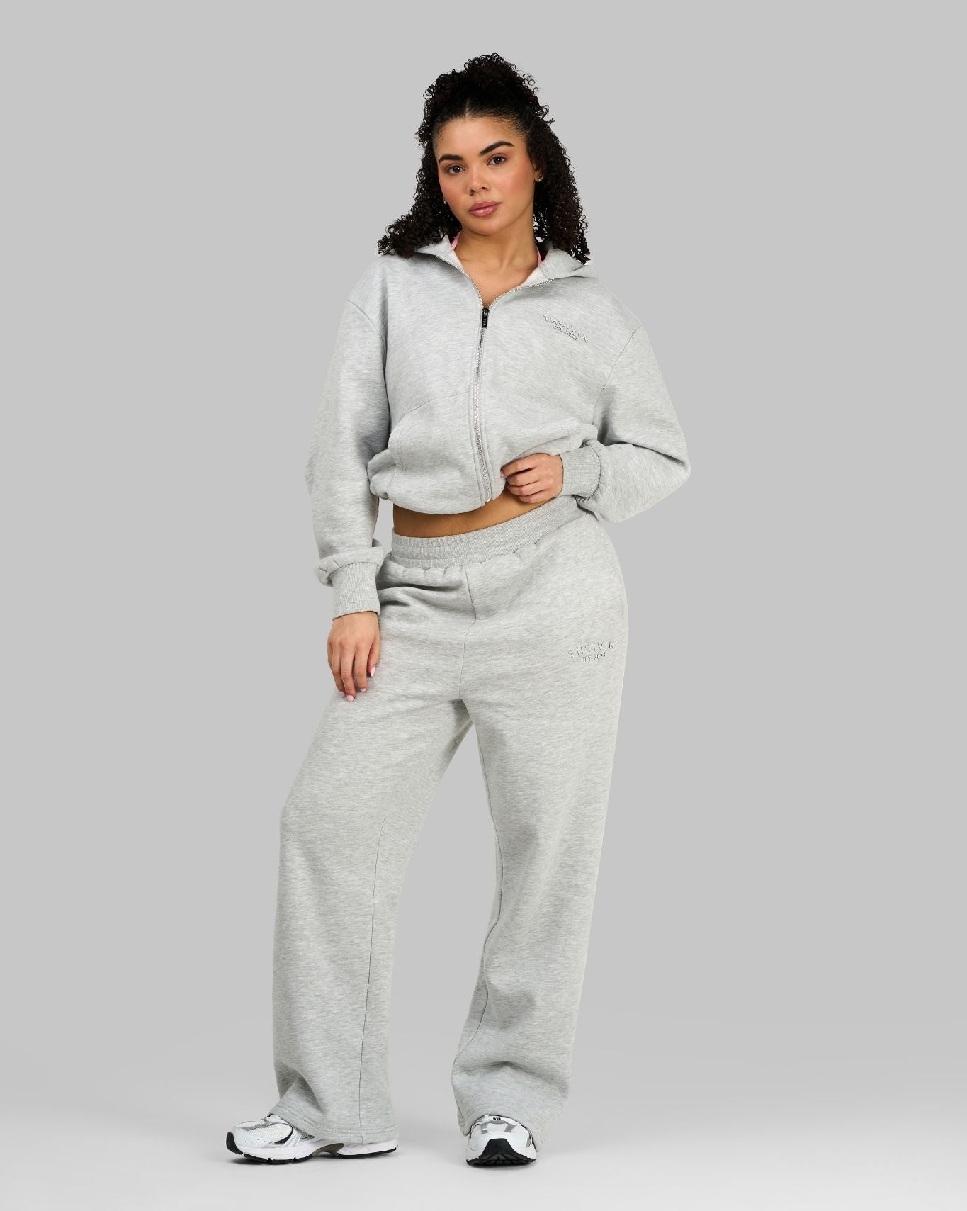 Alex is 5'5" and wears a size XS