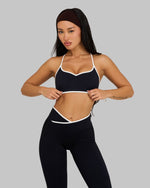 Lottie is 5’3” and wears size XS.